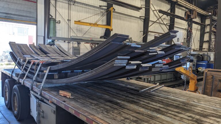 Rolled Heavy Flat Bar on back of a flatbed