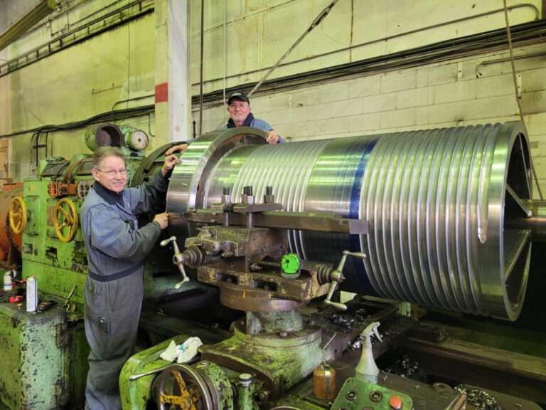 2 workers with a machined Pico Drum
