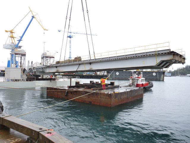 he secondary pontoon is moved into position before the ramp is lowered into place